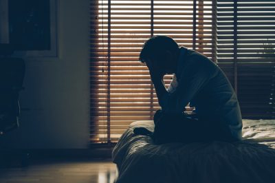 depressed man in dark room