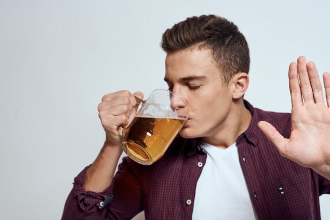 man drinking beer