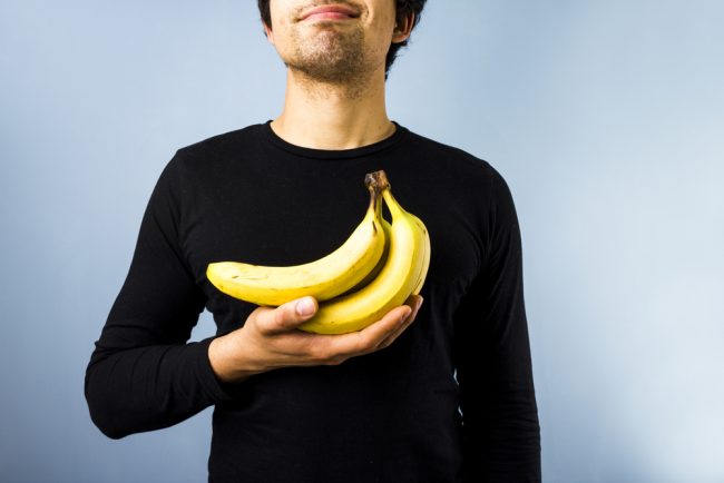 man holding bananas