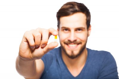 holding a pill