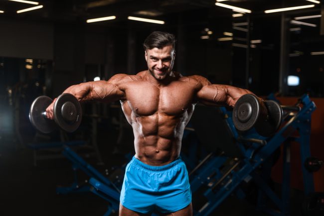 man holding dumbbells